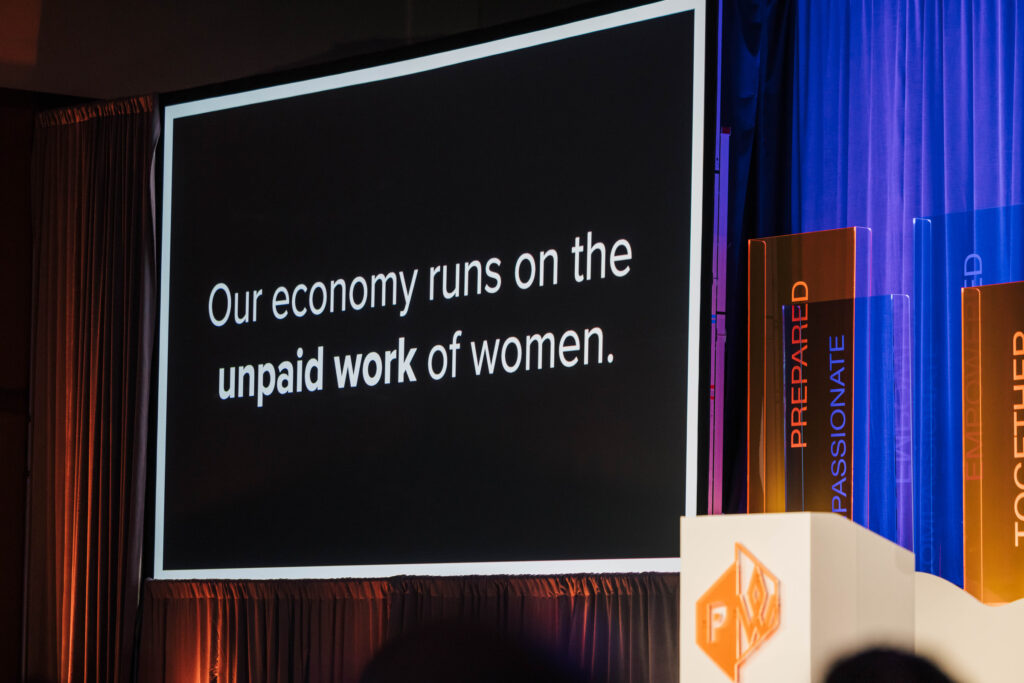 power point slide featuring text that states, "our economy runs on the unpaid work of women."