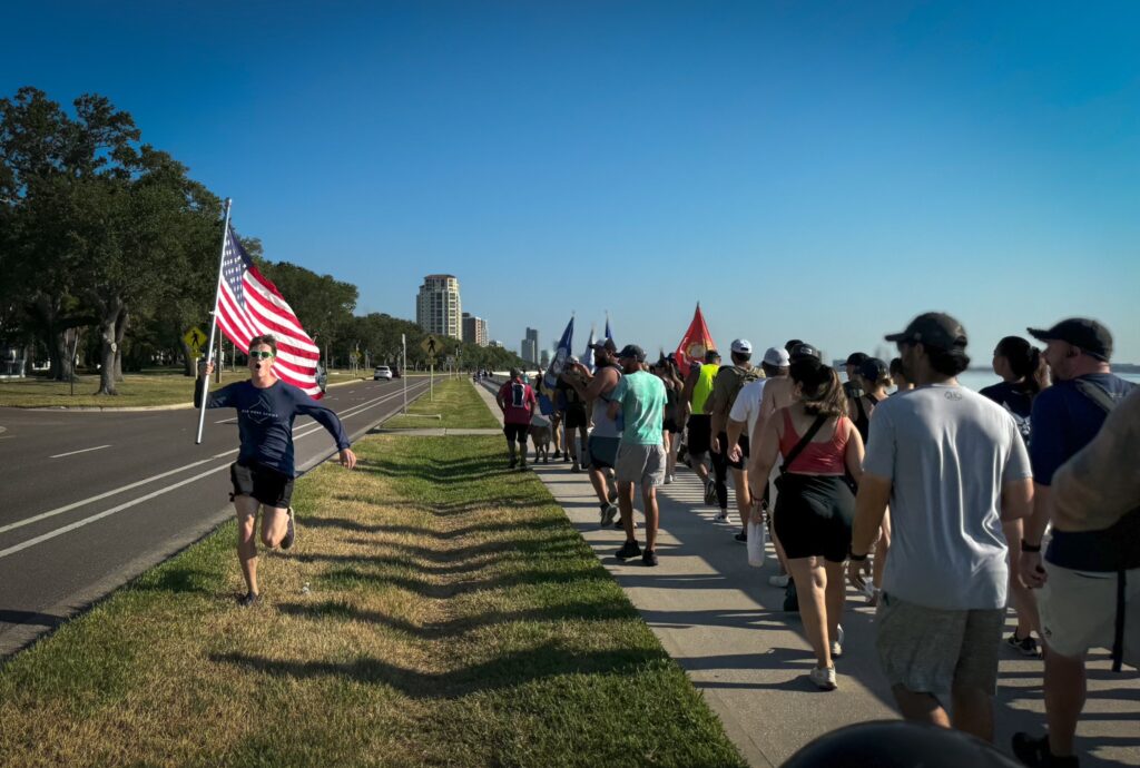 employees march in park for memorial day