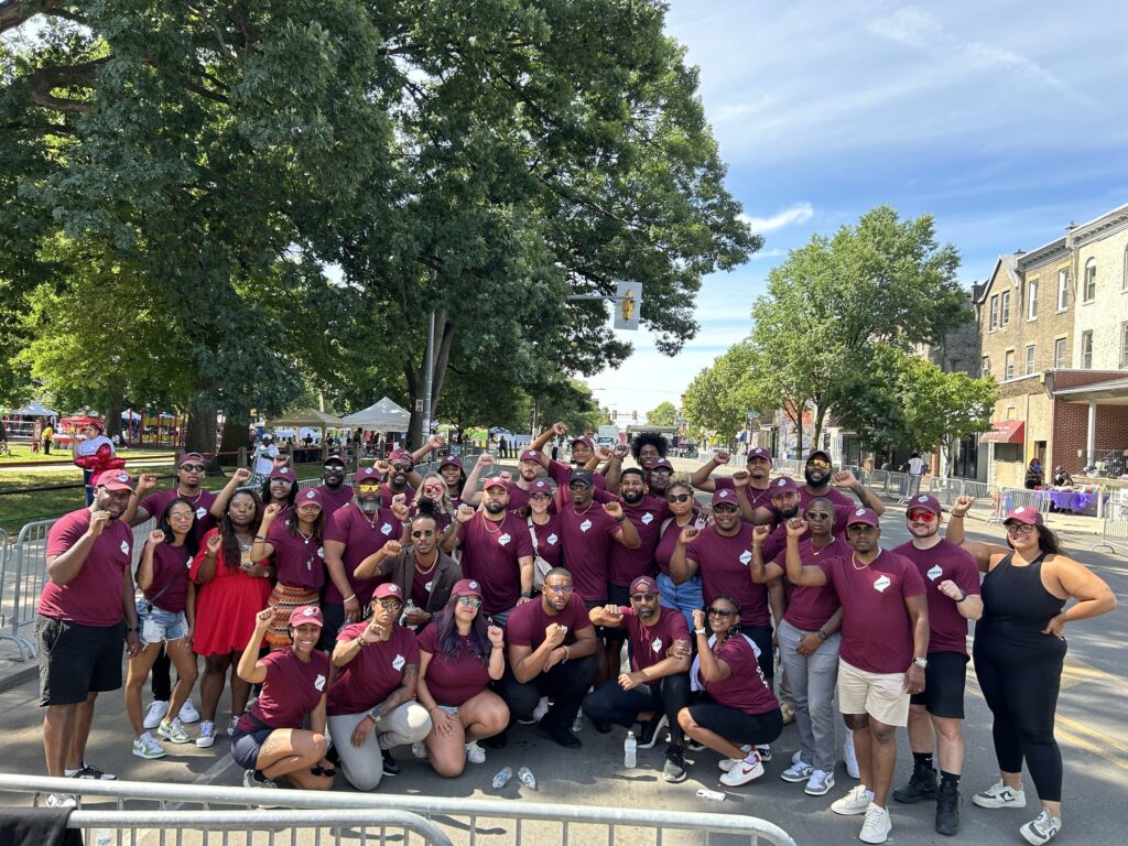 Attendees of POWER's Juneteenth event pose for a group photo at the Philadelphia Juneteenth Festival.