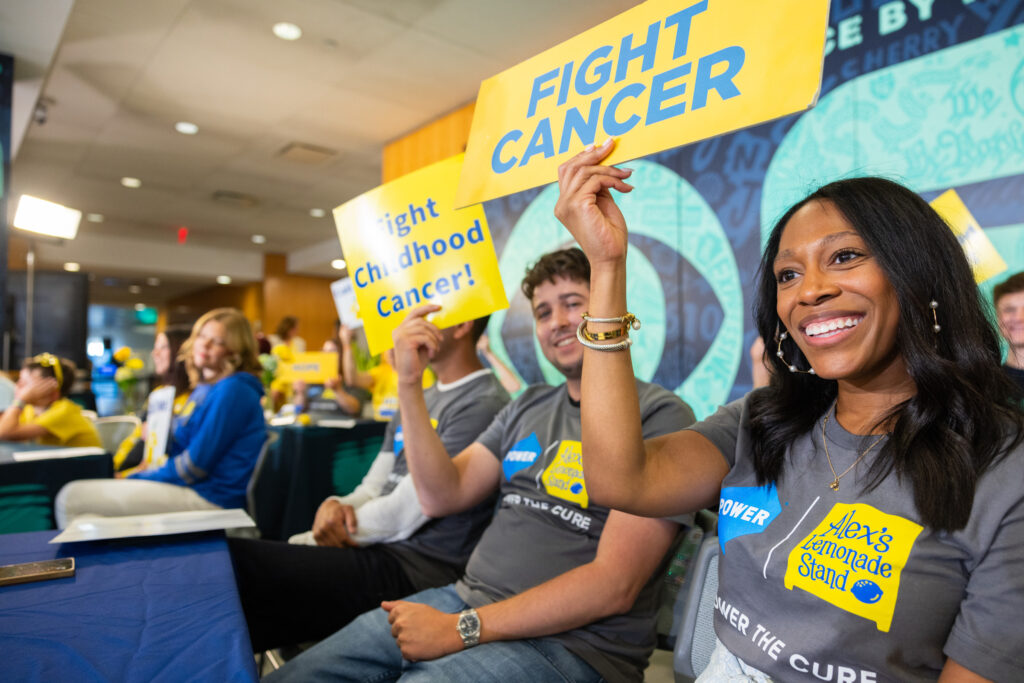 Power employees volunteer at a telethon to raise money for childhood cancer research.