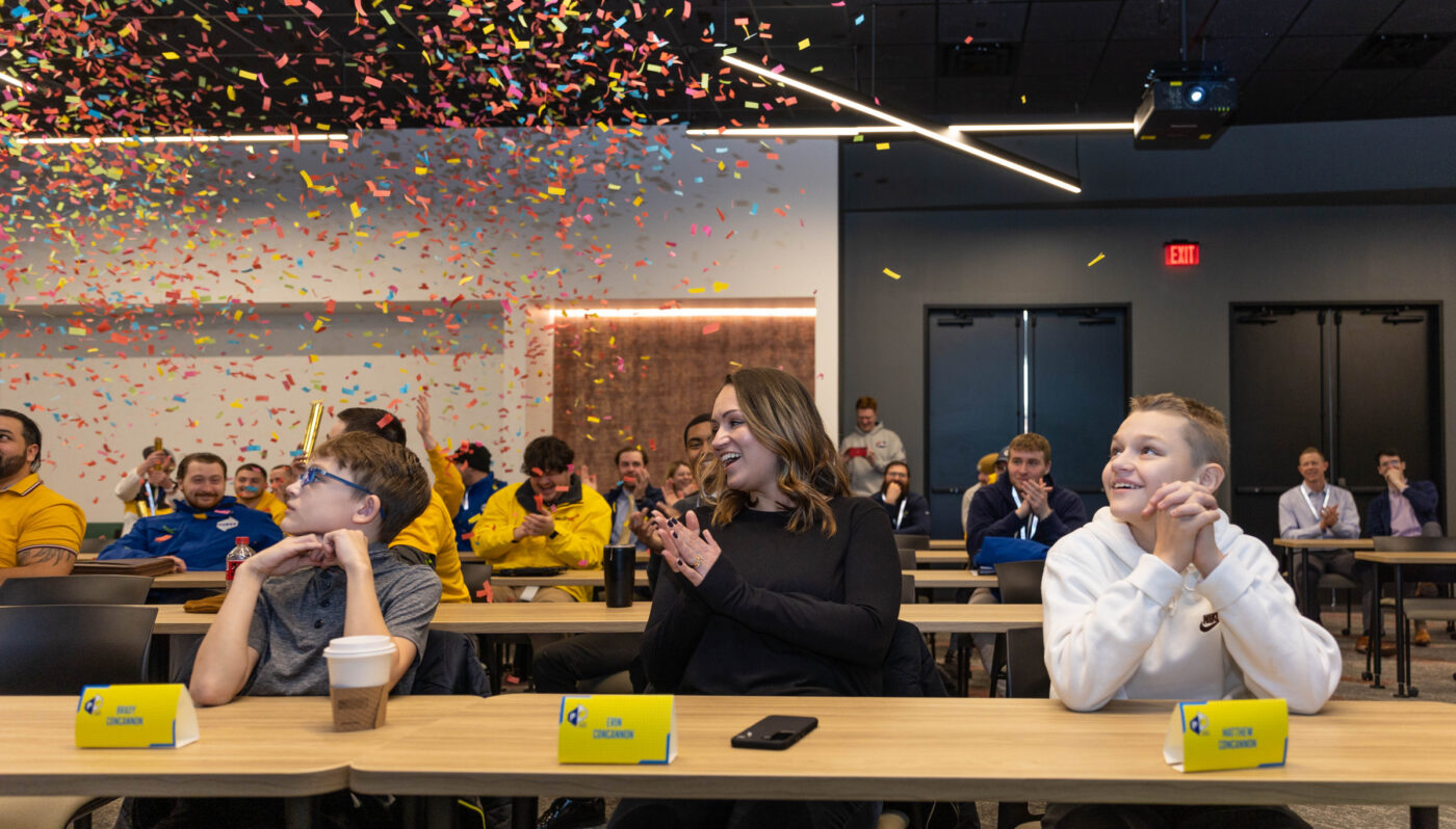 Employees kick off the Summer of Alex's Campaign with an office celebration and confetti.