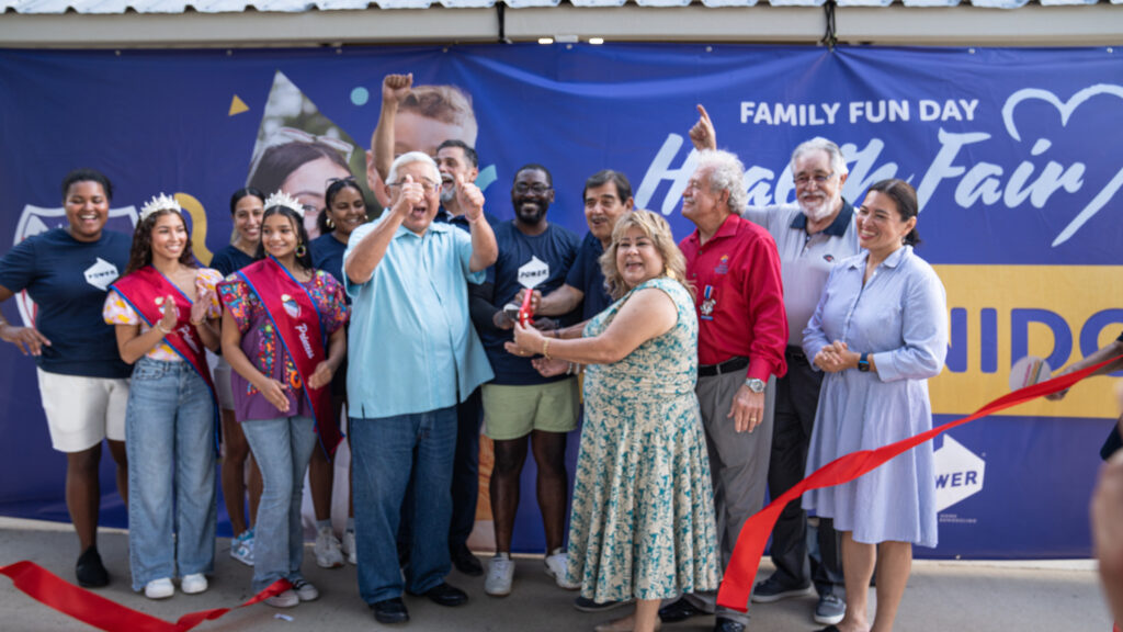 POWER employees and LULAC members do a ribbon cutting ceremony at the Health Fair.