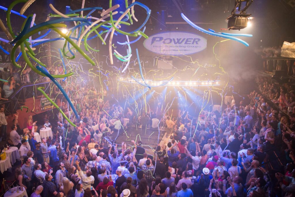 A large crowd of POWER employees celebrate at an evening event during their holiday party in Mexico back in 2013.