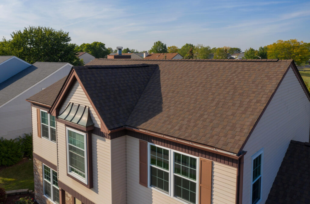 A POWER home showcasing a brown roof, that compliments Mocha Mousse. 